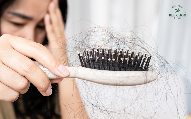 woman experiencing hair loss