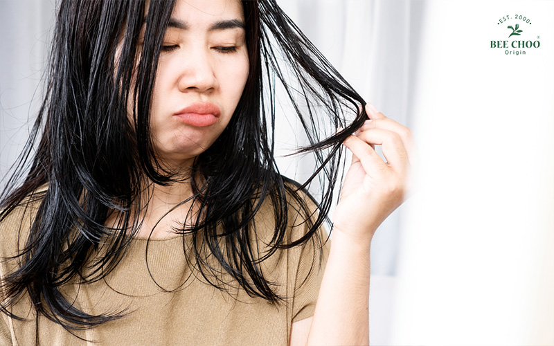 Lady who is unhappy with her oil hair