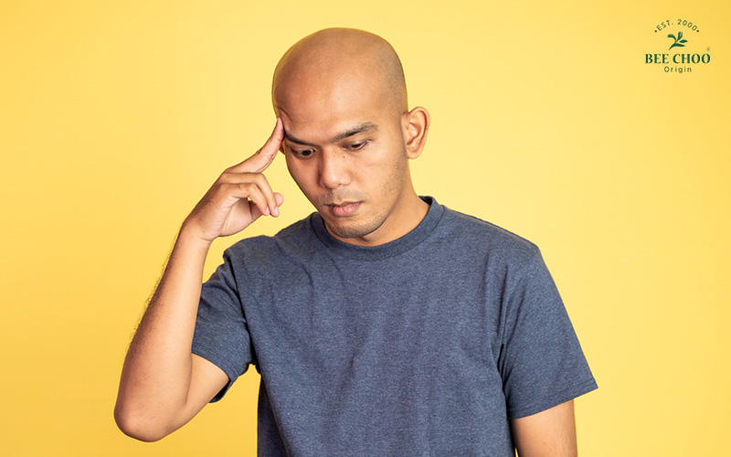 Male Pattern Baldness: How to Tackle Signs of Balding Hair 3 A man thinking