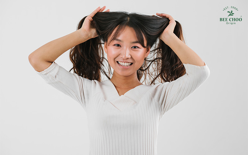A person running their hands through their hair