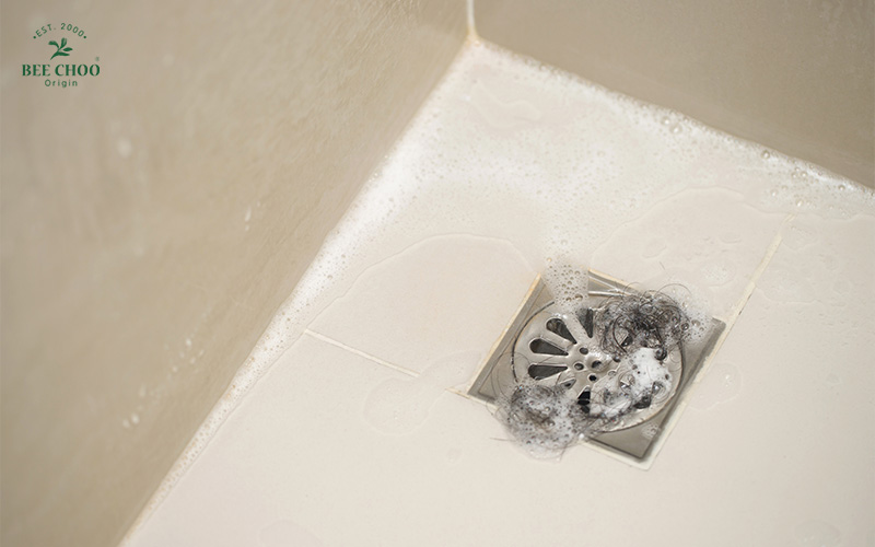 How Stress-Induced Hair Loss Happens and What You Can Do About It 1 Hair loss collected in a shower drain.