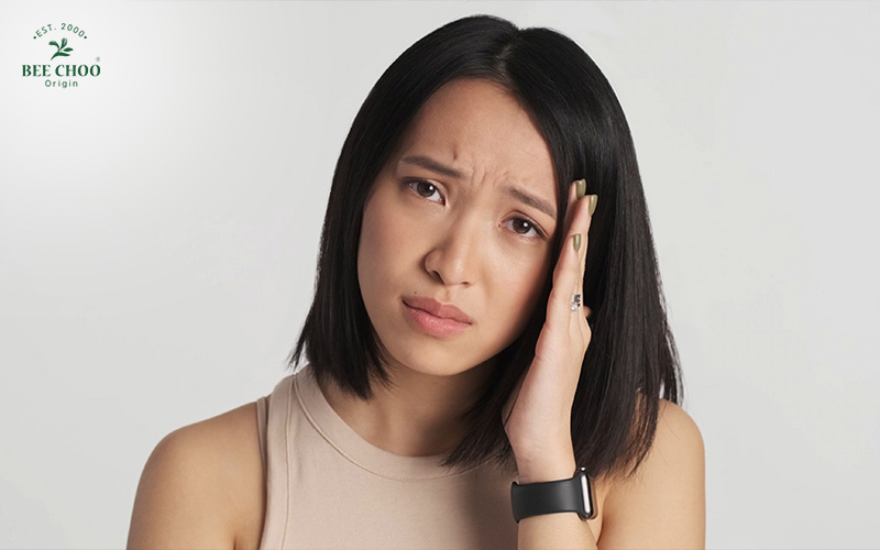 How Stress-Induced Hair Loss Happens and What You Can Do About It 2 Woman experiencing stress-related hair loss.